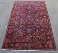 A large red and blue ground rug.