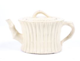 An 18/19th century Wedgwood creamware gathered caneware bamboo moulded teapot and lid.