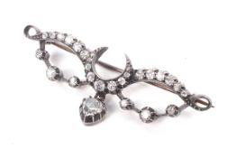 A late Victorian diamond crescent and scroll brooch.