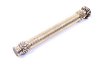 An early 19th century engine turned gold pencil.