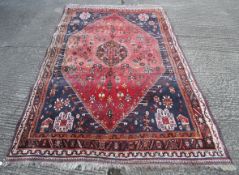 A large Kashgai rug.