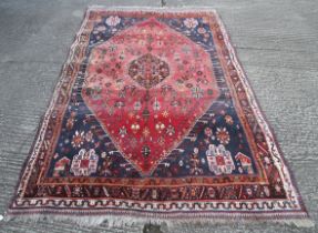 A large Kashgai rug.