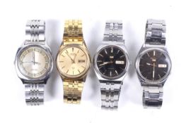 Four Seiko gentleman's stainless steel bracelet watches.