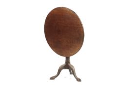 A Georgian mahogany bird cage tilt top table.