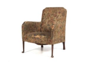 A Victorian mahogany pad foot upholstered armchair.