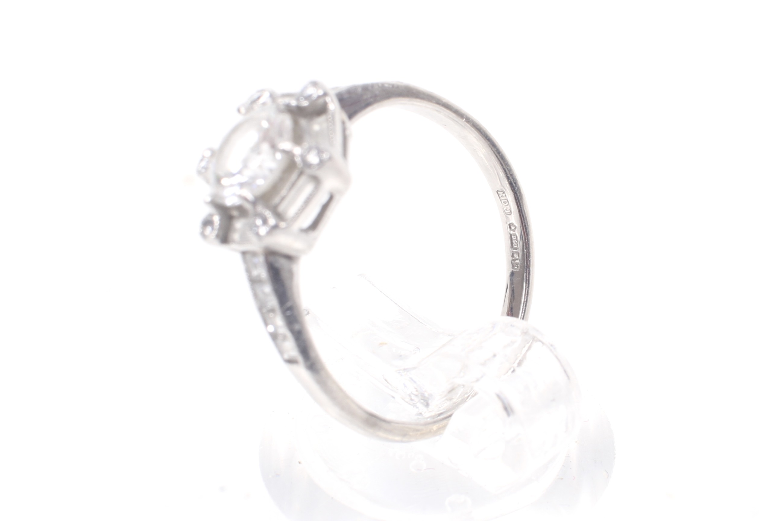 A modern platinum and diamond hexagonal cluster ring, circa 2007. - Image 4 of 12