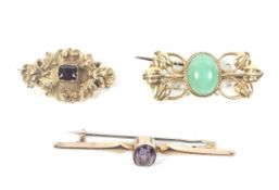 Three Victorian and later gold and gem set brooches.