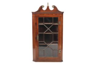 An 18th/19th century mahogany corner cabinet.