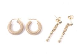 Two pairs of 9ct gold earrings.