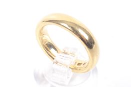 A 22ct gold court-section wedding band. Hallmarks for London 1929, 4.