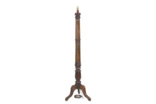 A William IV mahogany standard lamp on a tripod base with lotus flower decoration. H149.5cm.