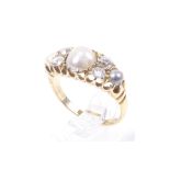 An Edwardian 18ct gold, half-pearl and diamond dress ring. Centred with a 7.