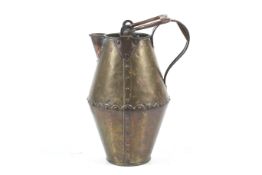 An Arts and Crafts hot water jug.