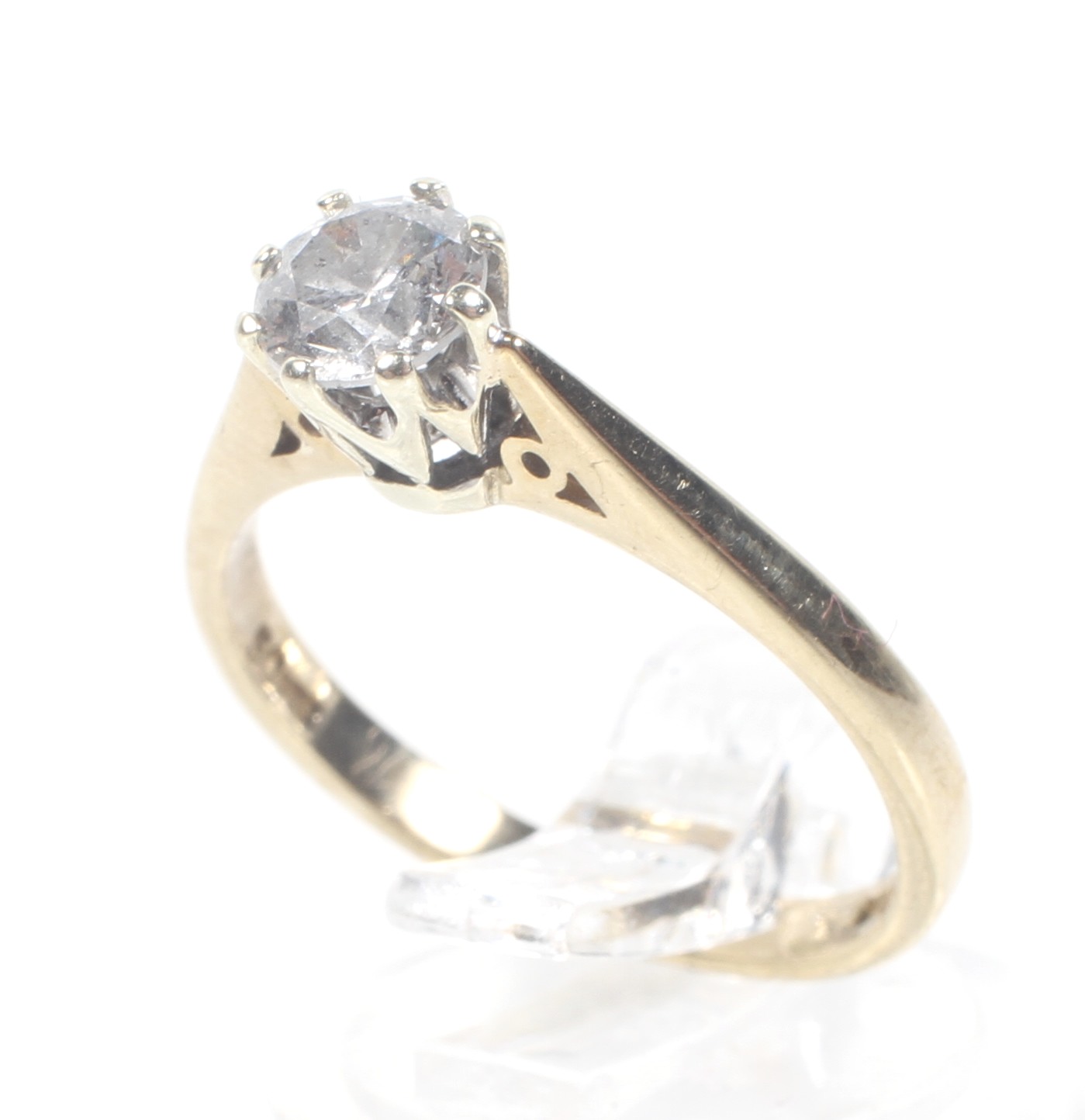 A vintage 9ct white and yellow gold and diamond solitaire ring. The round brilliant approx. 0.