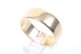 An early 20th century 18ct gold broad flat-section wedding band.