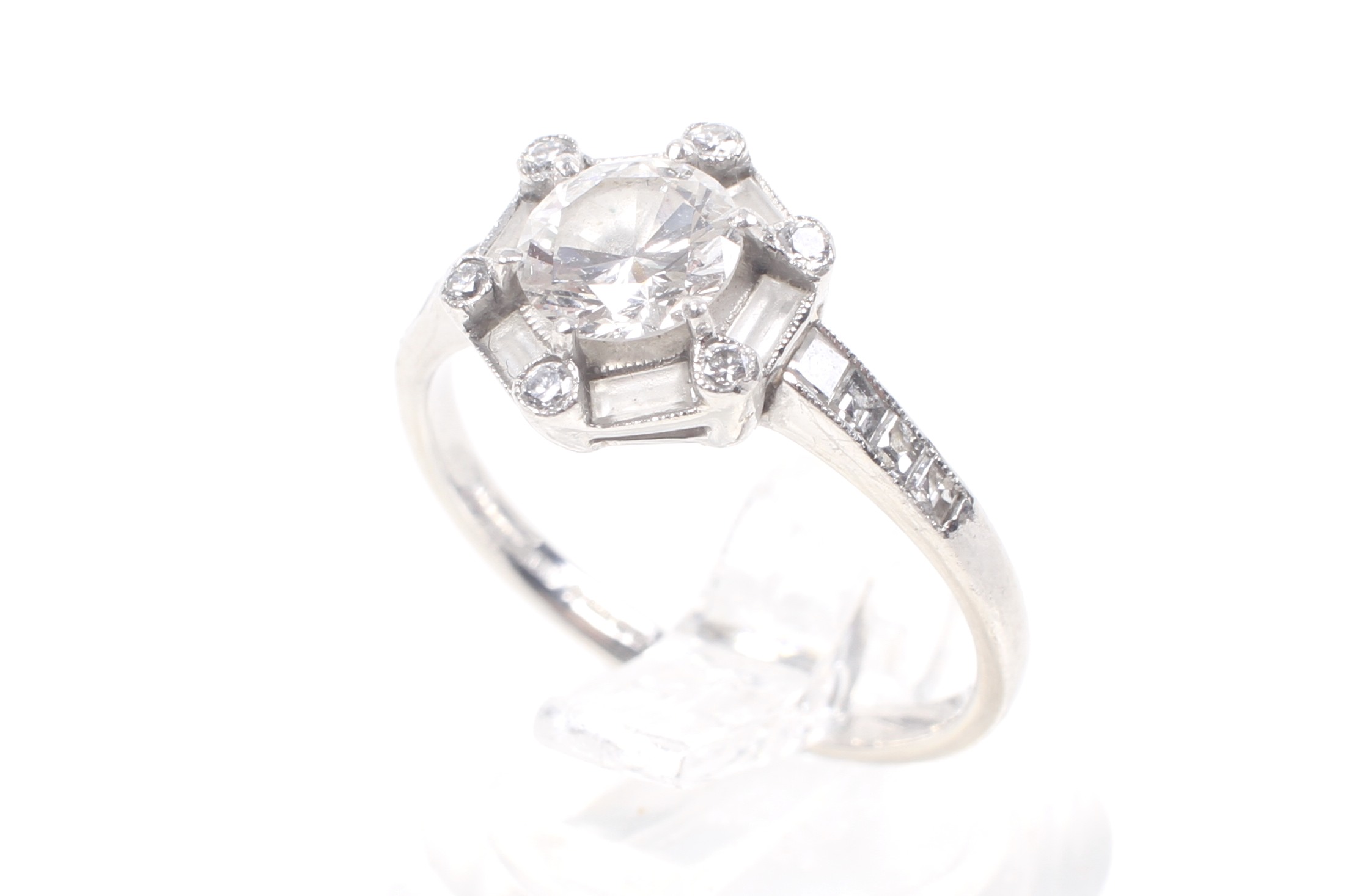 A modern platinum and diamond hexagonal cluster ring, circa 2007. - Image 7 of 12