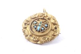 An early 19th century gold and turquoise mourning pendant.