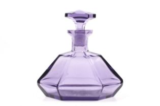 A vintage amethyst purple glass decanter.