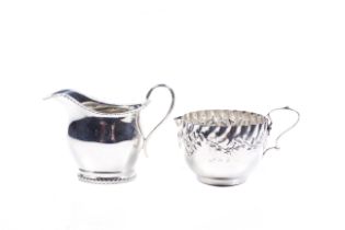 Two Victorian and later silver cream jugs.