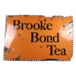 An advertising vitreous enamel sign for 'Brooke Bond Tea'.