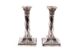 A pair of late Victorian silver candlesticks in Adam style.