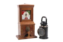 A Midland Railway Company mahogany cased signal box block instrument and a railway lantern.