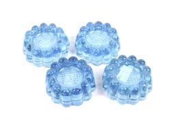 A set of four vintage light blue glass furniture caster cups. Of French design with scalloped edge.