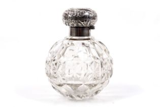 A Edwardian silver mounted clear cut glass spherical scent bottle.