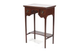 An Edwardian mahogany lady's side table.