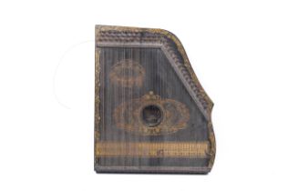 A late 19th century ebonised Valsonora zither.