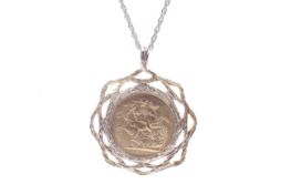 Sovereign, 1905(P), in a later textured 9ct gold pendant with an open woven border,