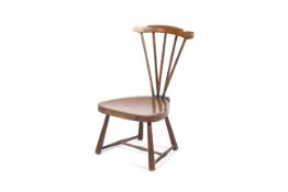 A 19th century stained mahogany child's Windsor chair.
