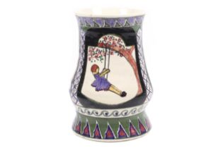 A vintage Studio Pottery vase decorated with three scenes of a girl on a swing.