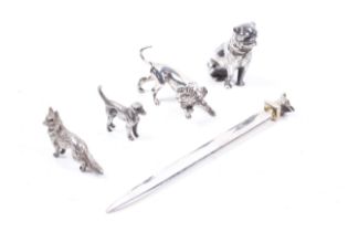 Various vintage silver and unmarked white metal models of animals and a silver paper knife.