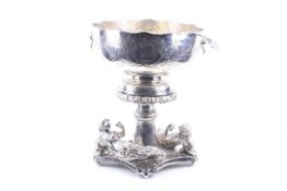 A vintage silver-plated copper punch bowl on an associated plated stand and with a plated punch
