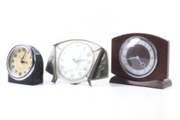 Three assorted mechanical clocks. Comprising two Metamec examples and an alarm clock. Max.