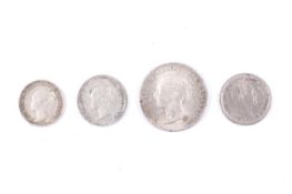 Four 19th century small silver coins.