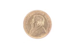 A South Africa, gold 1 Pond coin. Dated 1898. Tiny rim nick.