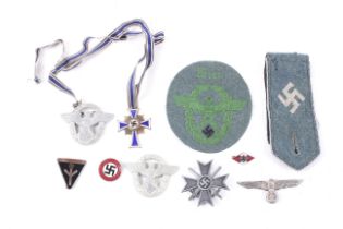 An assortment of mostly German WWII badges.