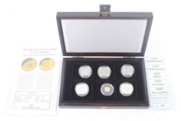 A boxed set of five silver proof coins.