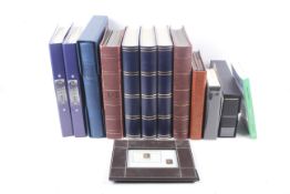 A collection of stamp albums and stock books.