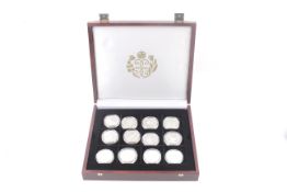 A collection of 24 silver proof crown sized coins. In honour of the Queen Mother.