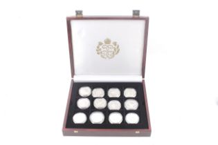 A collection of 24 silver proof crown sized coins. In honour of the Queen Mother.