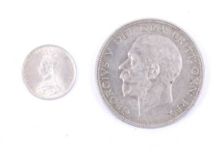 Four 19th century and later British coins. Comprising a 1934 half crown and an 1887 threepence.