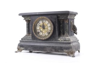 A Victorian black marble effect wooden cased mantel clock. 8 day movement.