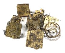 An assortment of vintage clock mechanisms. Including pieces for mantel clocks, carriage clocks, etc.