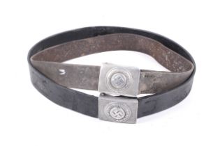 Two WWII German military leather belts with metal buckles with insignias.