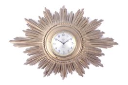 A 20th century English 'Sunburst' wall clock. The 8 day movement by Smiths English Clocks Ltd.