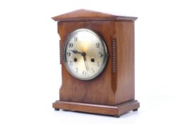 A 20th century mahogany cased mantel clock. 8 day striking movement.