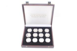 A collection of 24 silver proof coins. Crown sized, in honour of the Queen Mother.